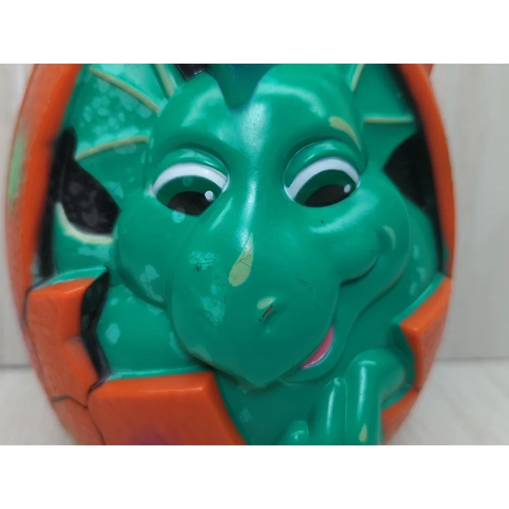 Busch Gardens Land of the Dragons orange egg carry case green baby dragon